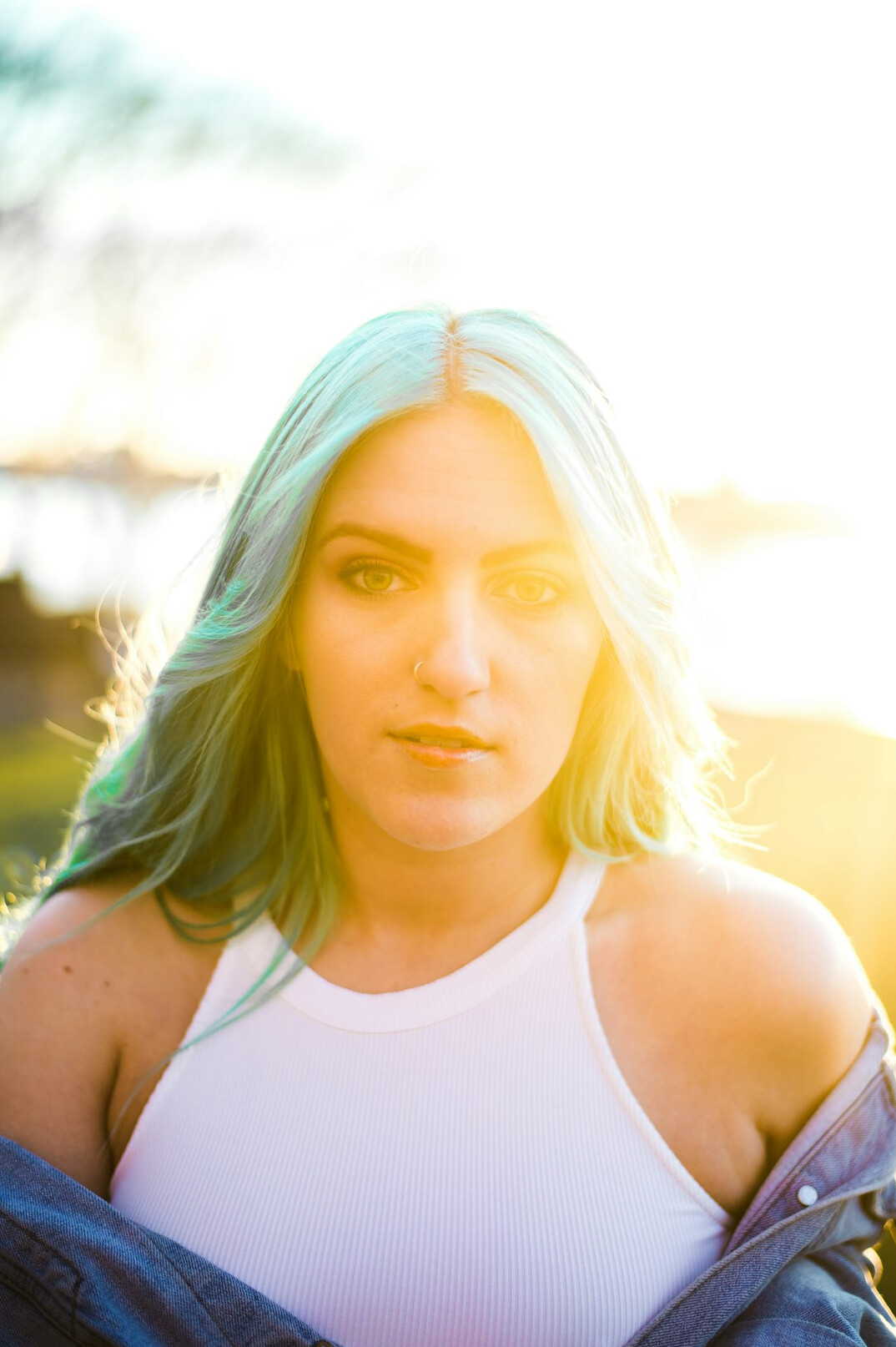 Portrait of a woman with blonde hair in a bright setting
